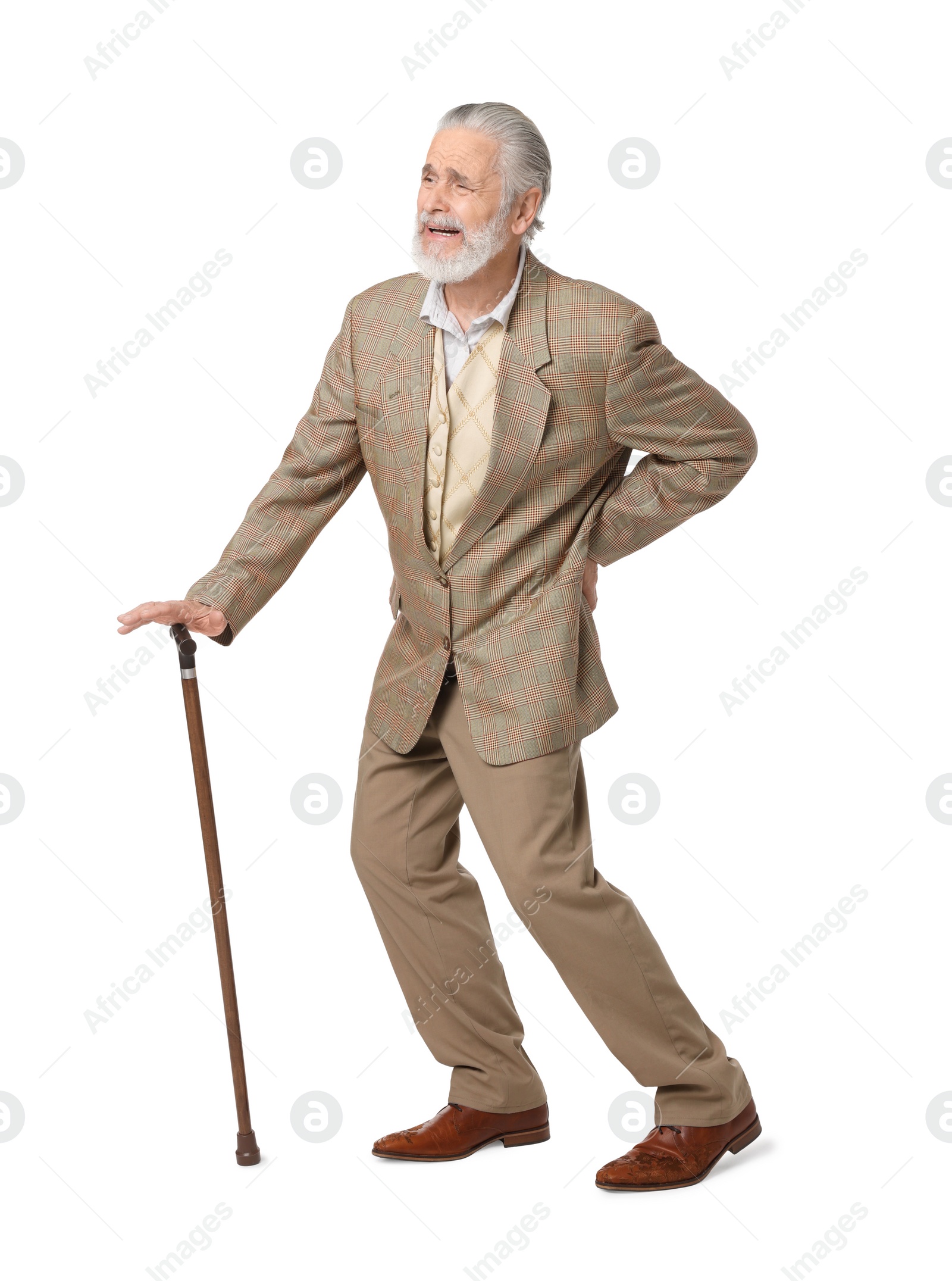 Photo of Senior man with walking cane suffering from back pain on white background