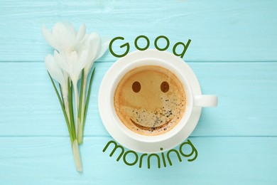 Image of Cup of morning coffee and crocuses on light blue wooden table, flat lay