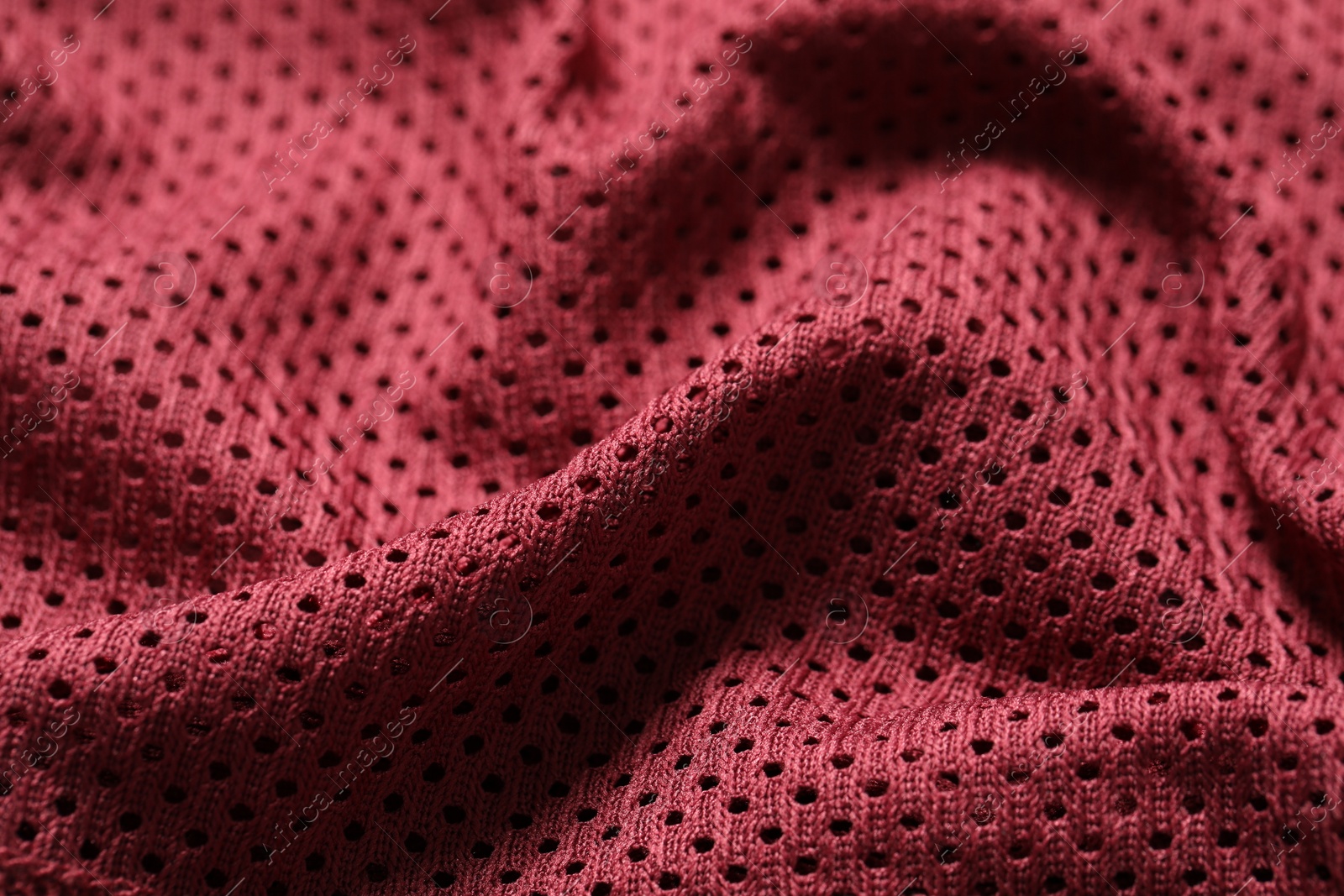 Photo of Texture of burgundy fabric as background, closeup