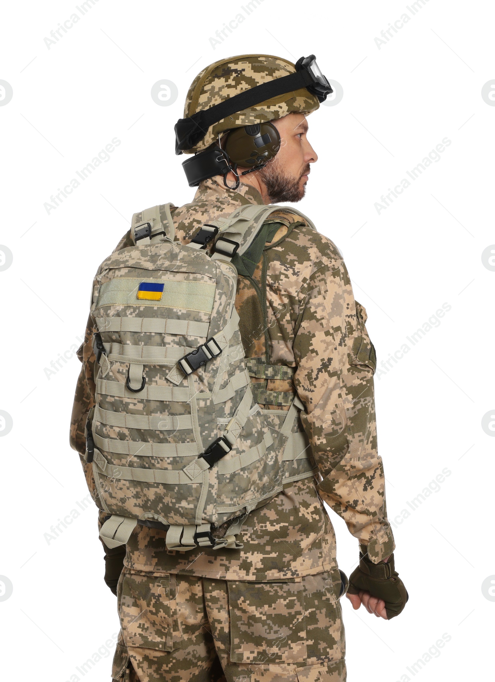 Photo of Soldier in Ukrainian military uniform with tactical goggles and backpack on white background