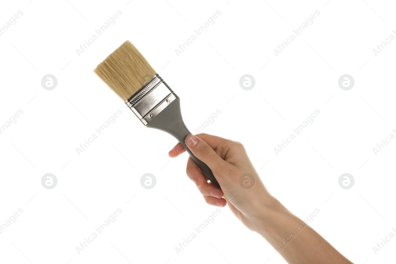 Photo of Woman holding paint brush on white background, closeup