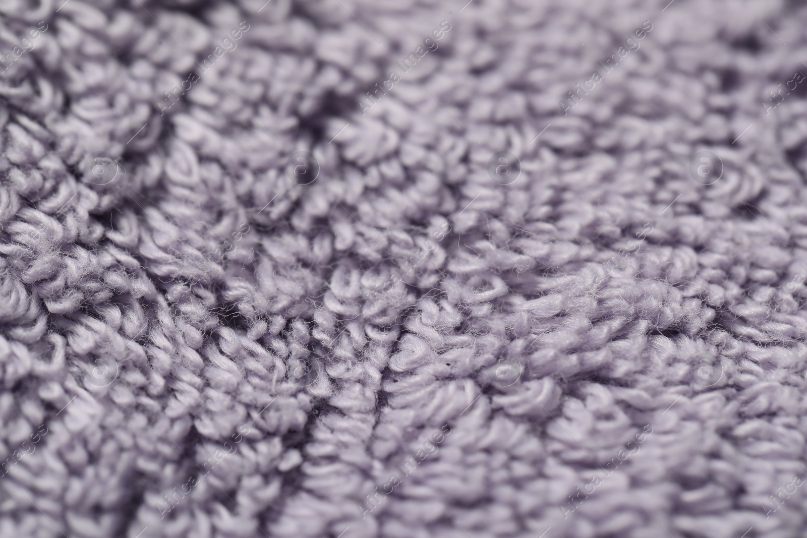 Photo of Texture of soft violet fabric as background, closeup