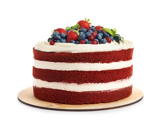 Delicious homemade red velvet cake with fresh berries on white background