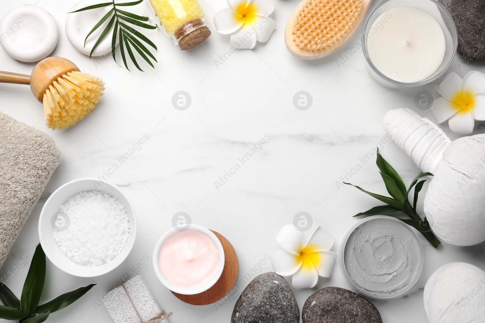 Photo of Flat lay composition with different spa products on white marble table. Space for text