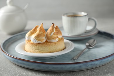 Delicious lemon meringue pie on grey table, closeup
