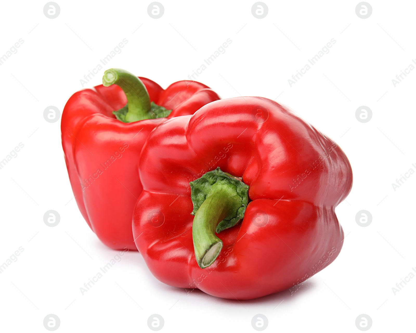 Photo of Raw ripe paprika peppers on white background