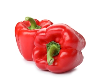 Photo of Raw ripe paprika peppers on white background