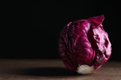 Photo of Tasty fresh red cabbage on wooden table, space for text