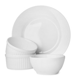 Photo of Set of clean tableware on white background