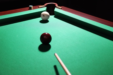 Photo of Striking red ball into billiard table pocket