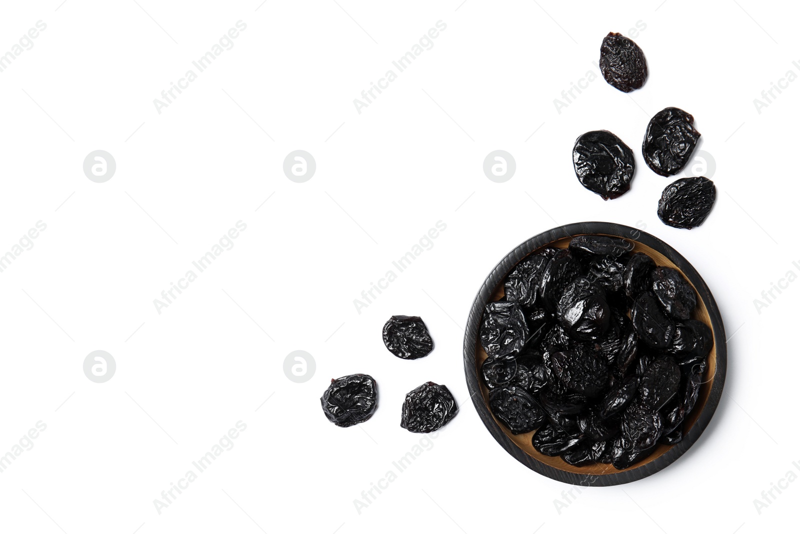 Photo of Plate of sweet dried plums on white background, top view with space for text. Healthy fruit