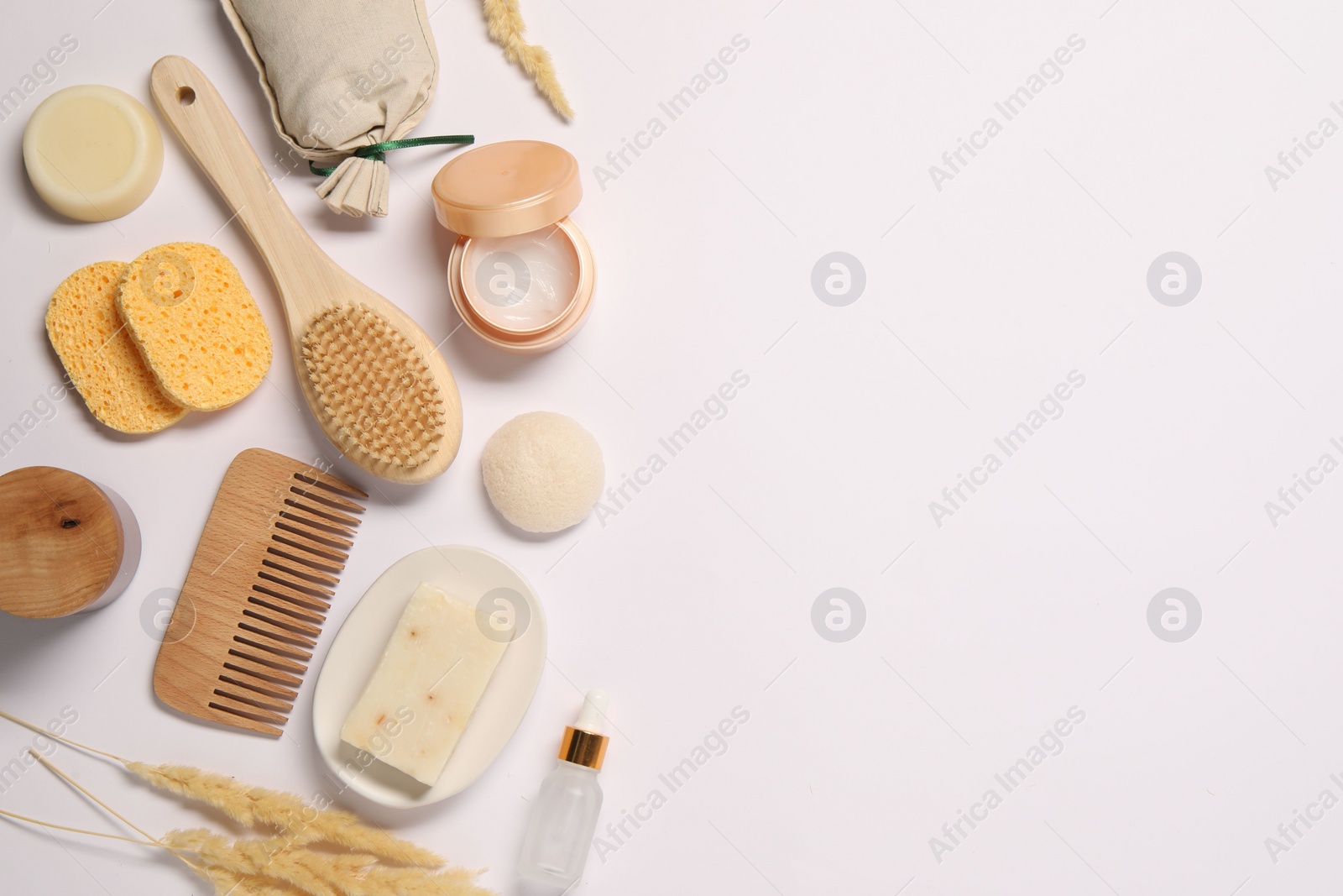 Photo of Bath accessories. Different personal care products and dry spikelets on white background, flat lay with space for text