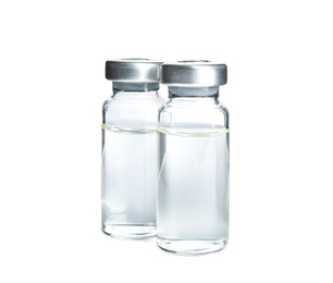 Photo of Vials with medication on white background. Vaccination and immunization