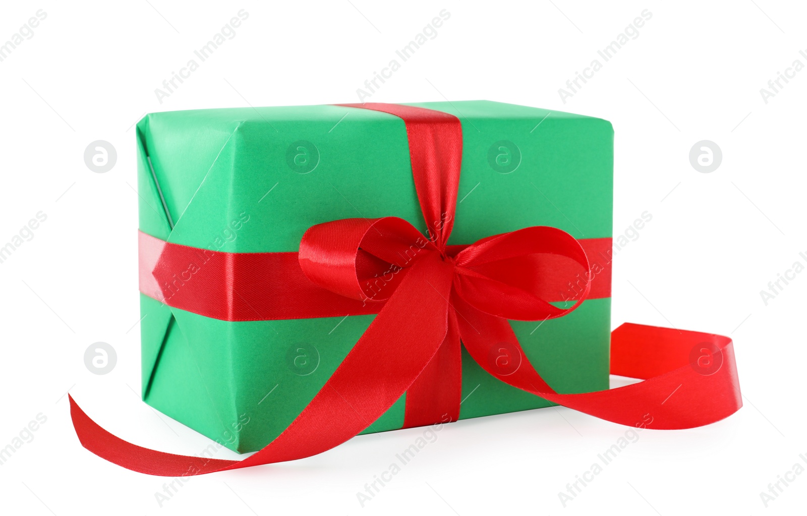 Photo of Christmas gift box decorated with ribbon bow on white background