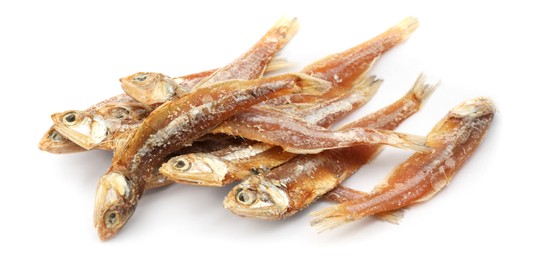 Photo of Delicious dried salted anchovies on white background