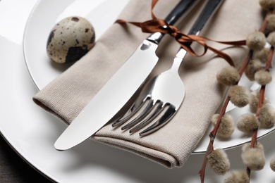 Festive Easter place setting with egg on table, closeup