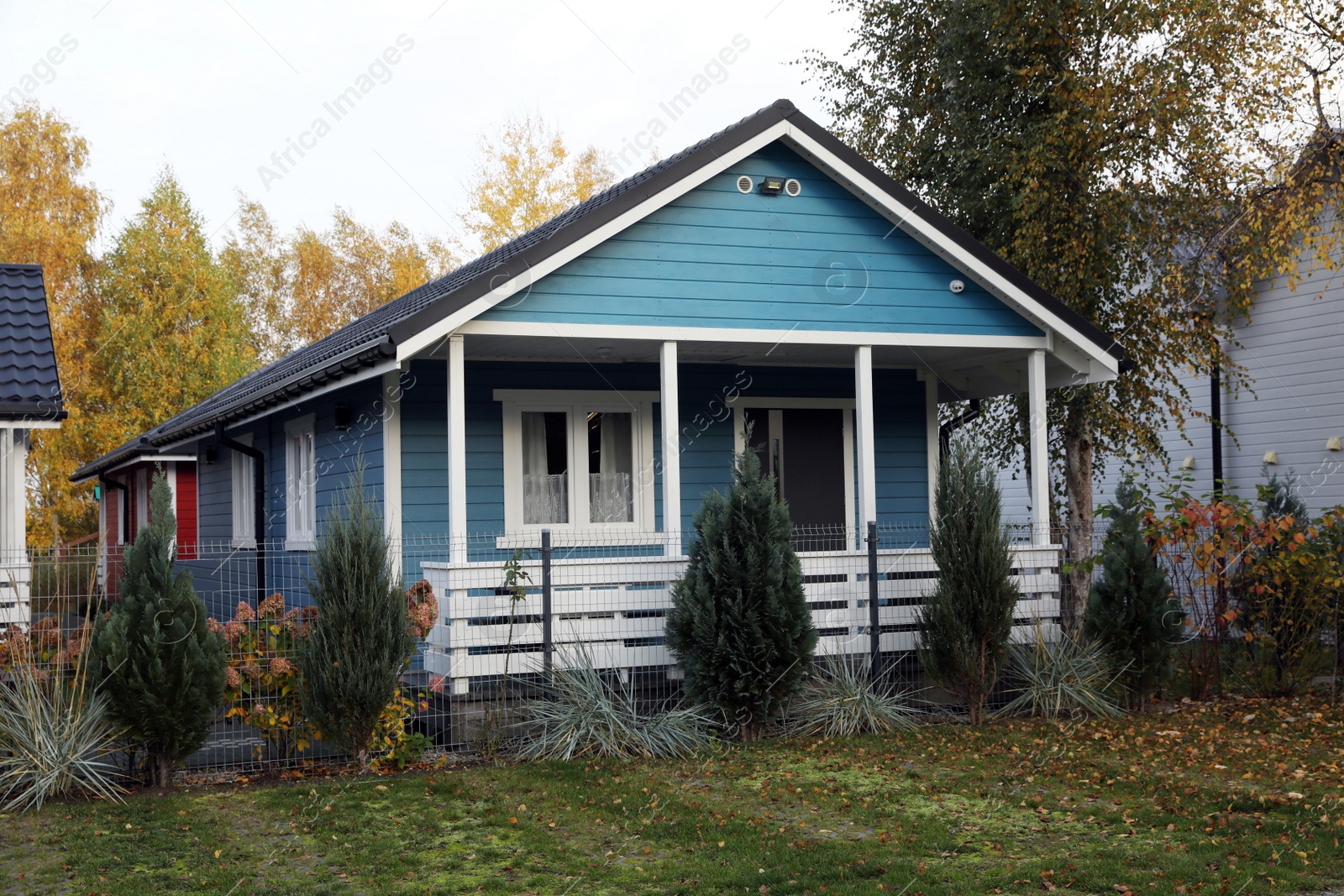 Photo of Beautiful light blue house outdoors. Real estate