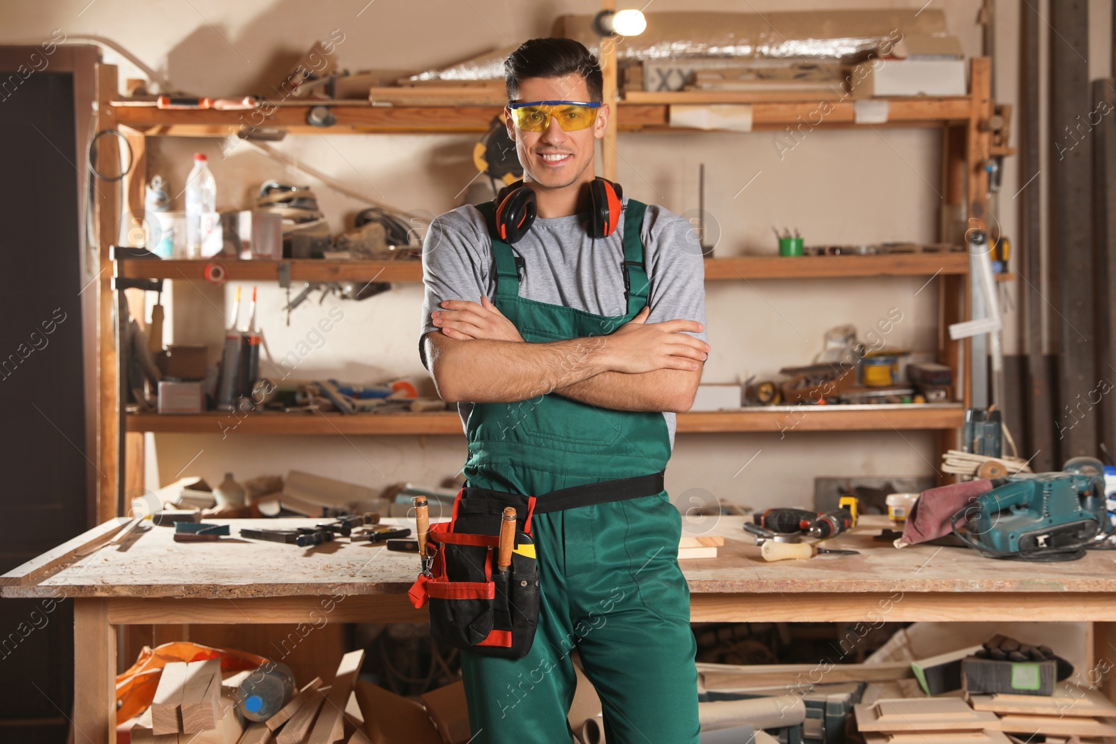 Photo of Professional carpenter with set of tools in workshop