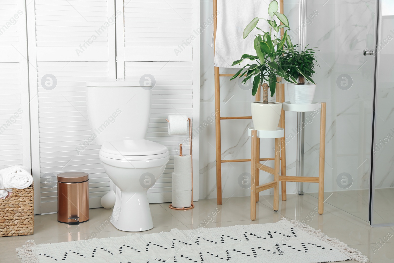 Photo of Stylish toilet bowl in modern bathroom interior