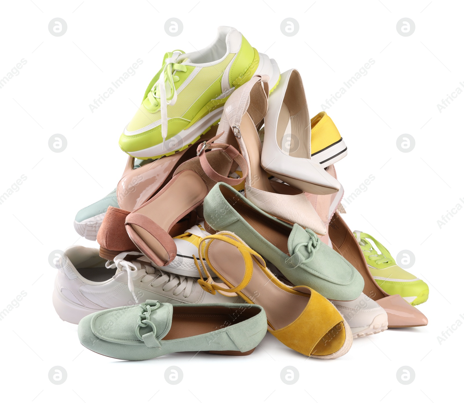 Photo of Pile of different female shoes isolated on white