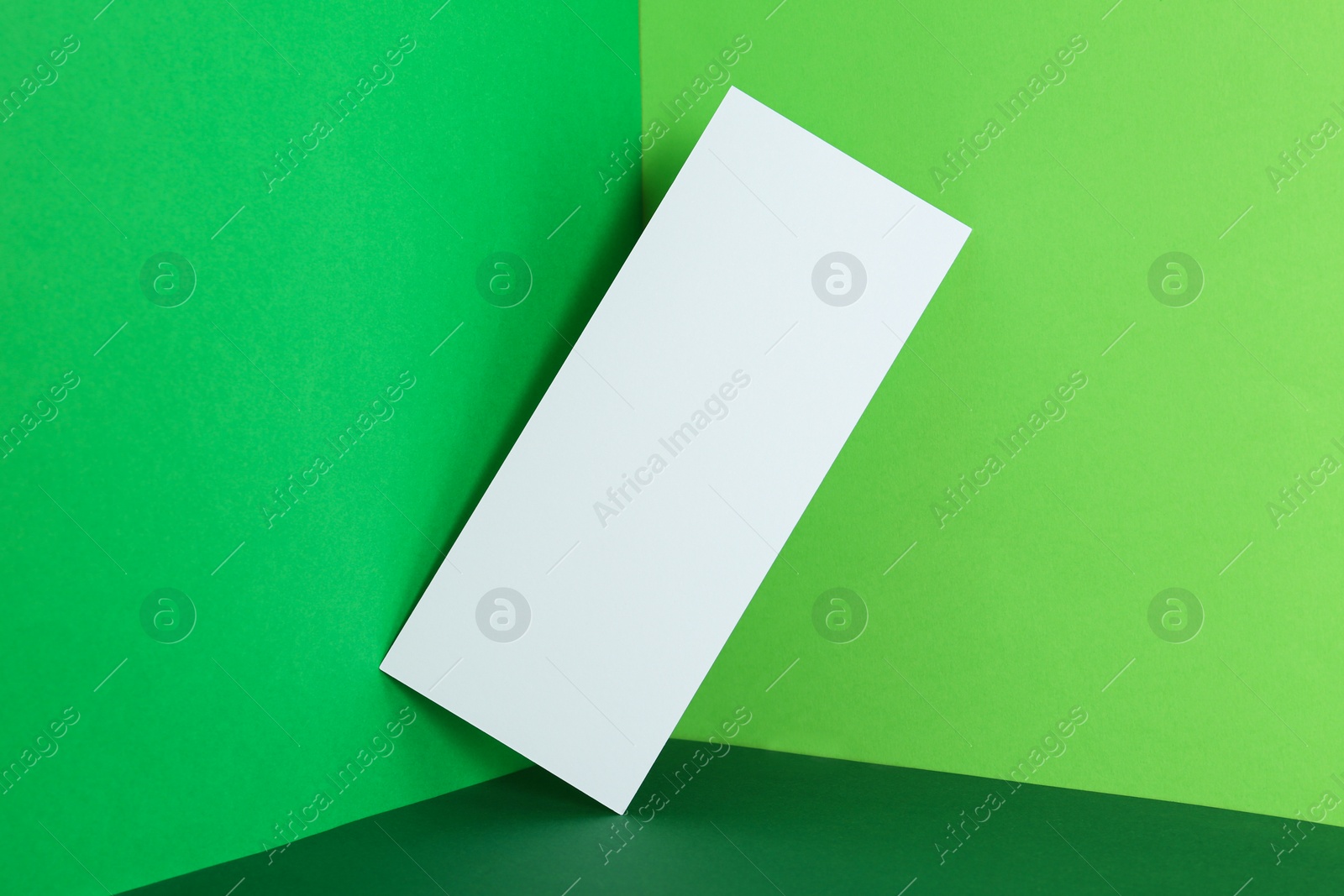 Photo of Empty sheet on color background. Mockup for design