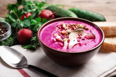 Delicious cold summer beet soup on table