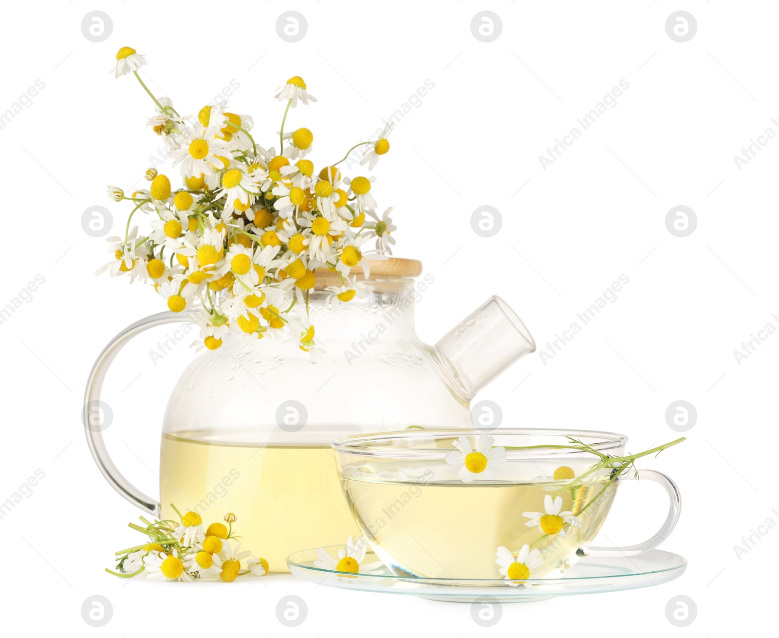 Photo of Aromatic herbal tea with chamomile flowers isolated on white