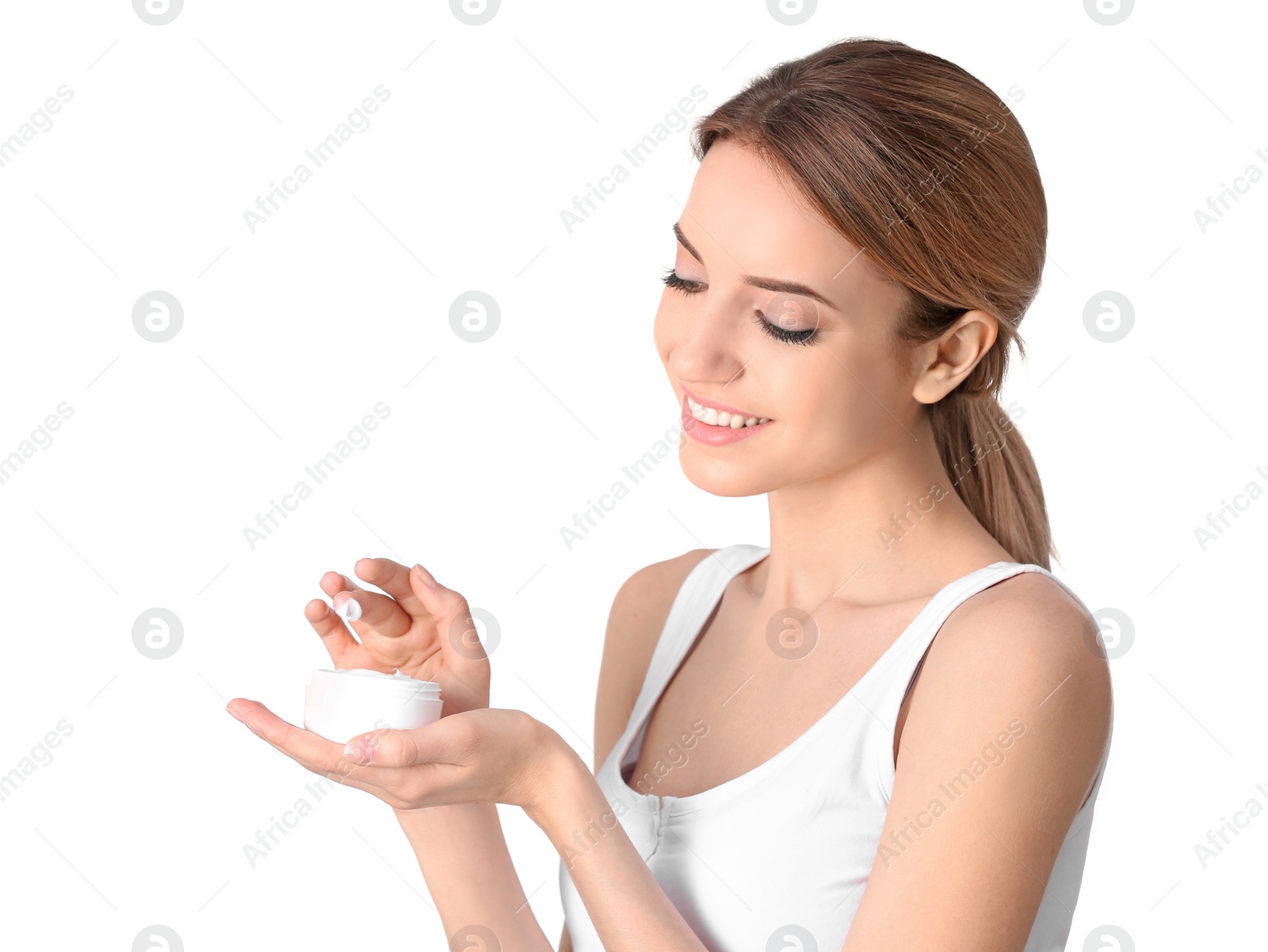 Photo of Young woman with jar of hand cream on white background