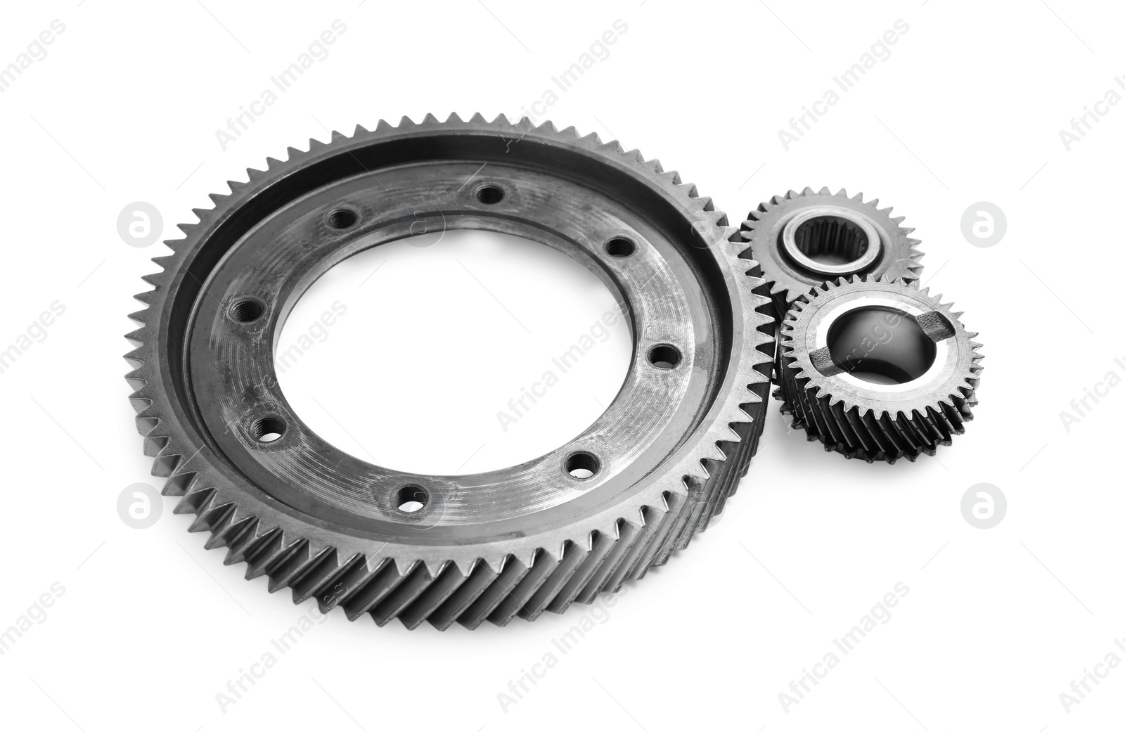 Photo of Different stainless steel gears on white background