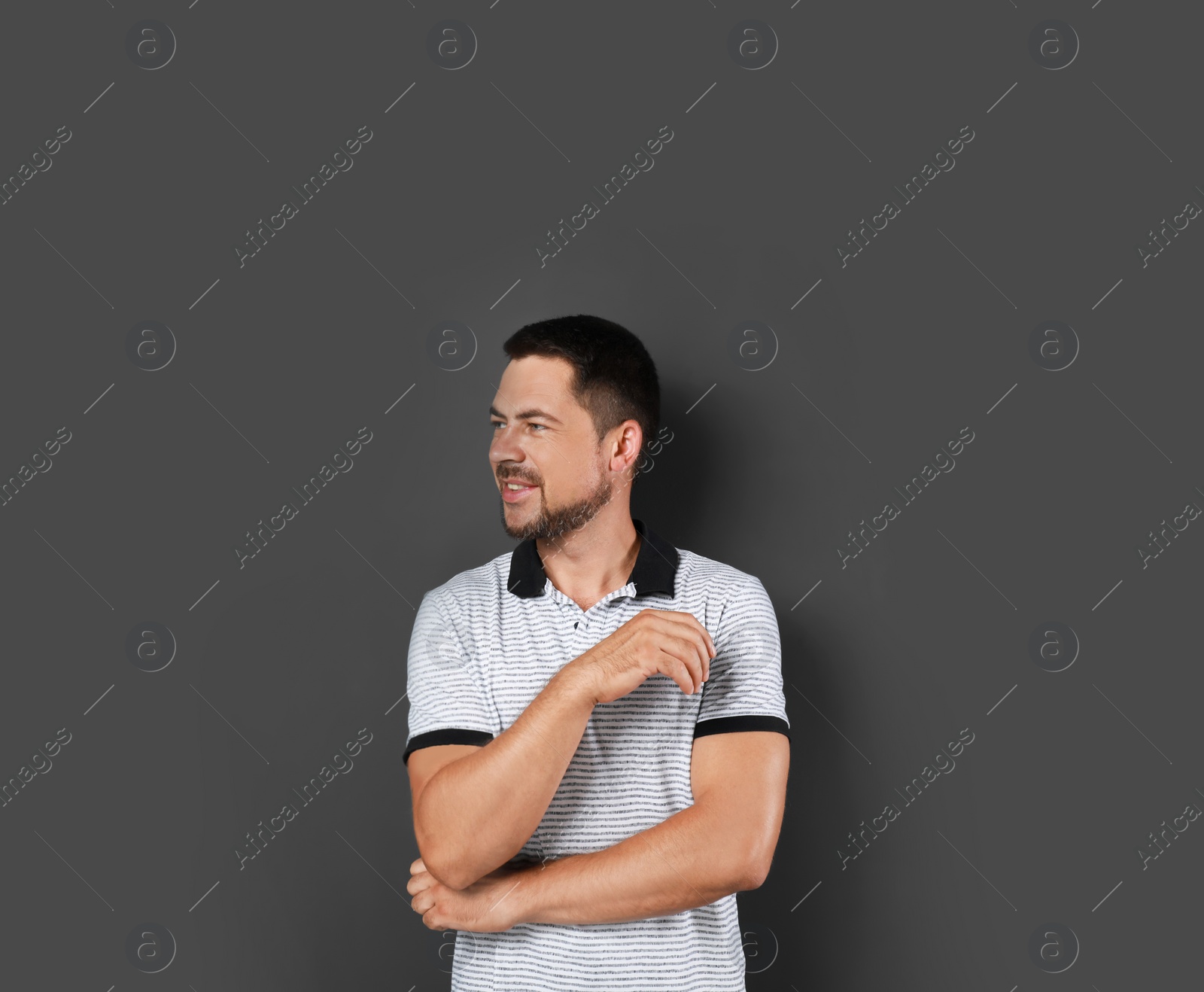 Photo of Portrait of handsome man on dark background