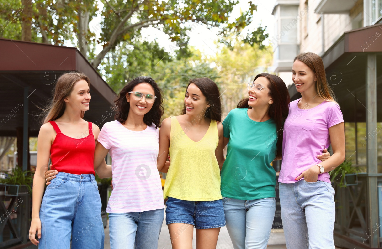 Photo of Happy women outdoors on sunny day. Girl power concept