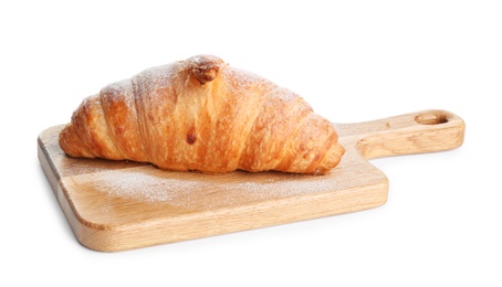 Photo of Wooden board with tasty croissant and powdered sugar on white background. French pastry