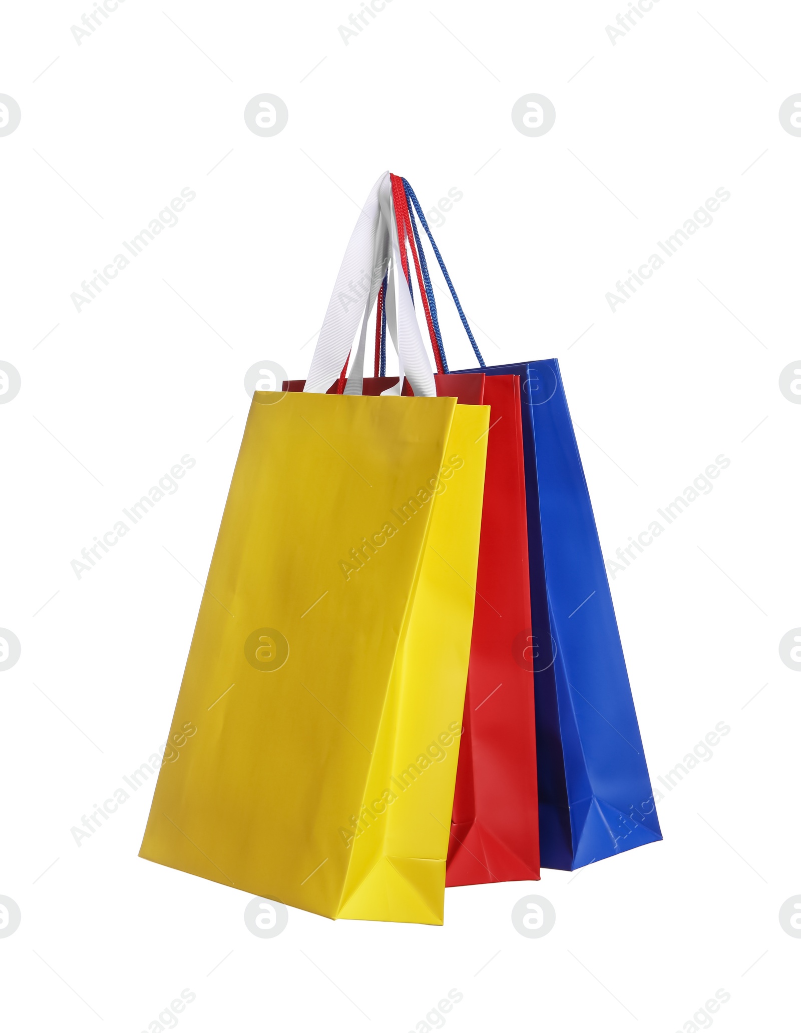 Photo of Colorful paper shopping bags isolated on white