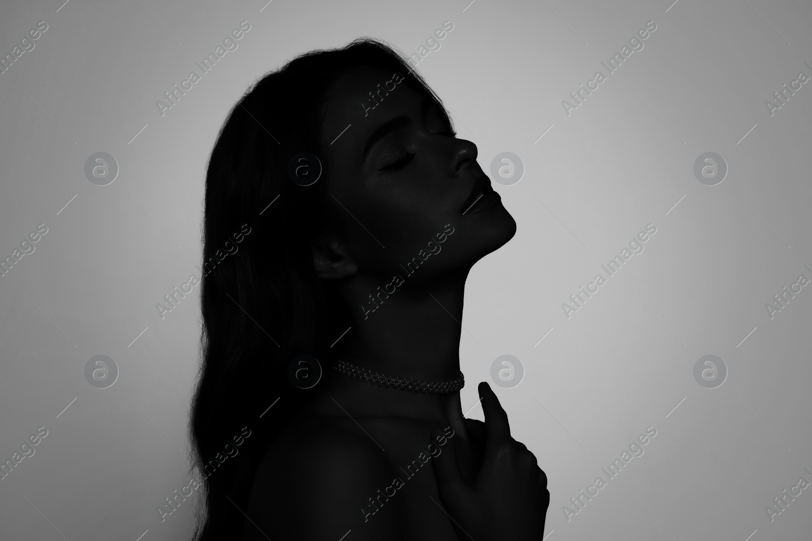 Image of Silhouette of one woman on light grey background