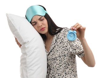 Photo of Sleeping woman with alarm clock and pillow on white background. Being late concept