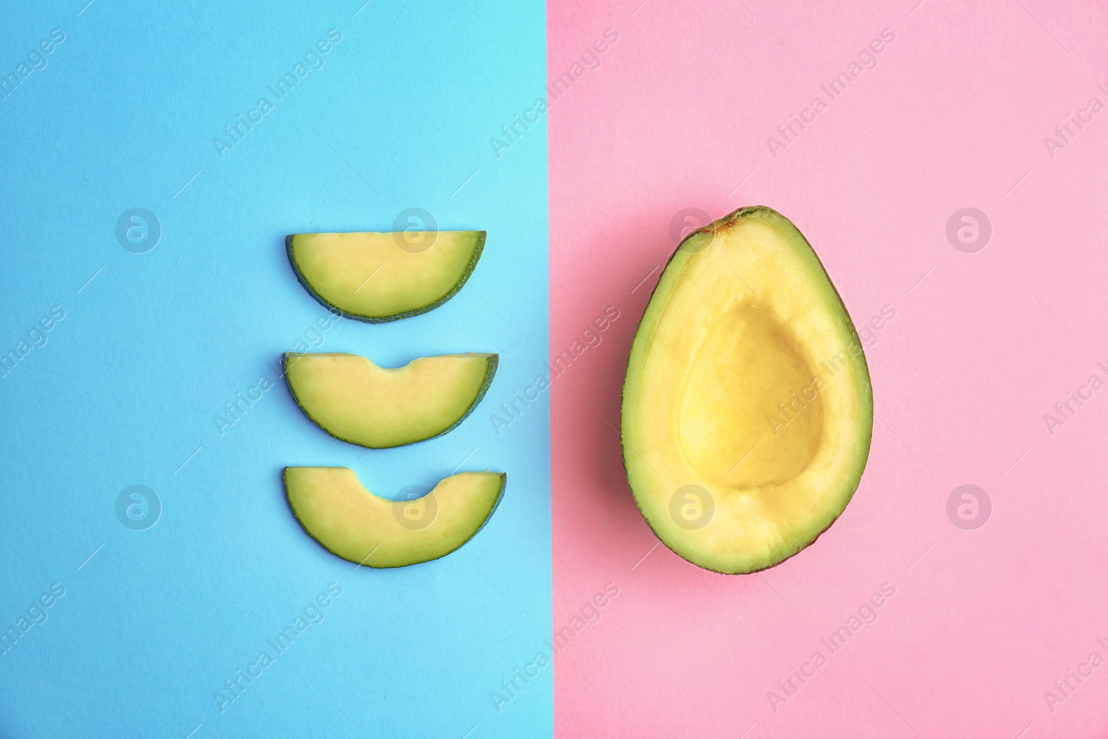 Photo of Flat lay composition with ripe avocado on color background