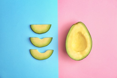 Photo of Flat lay composition with ripe avocado on color background