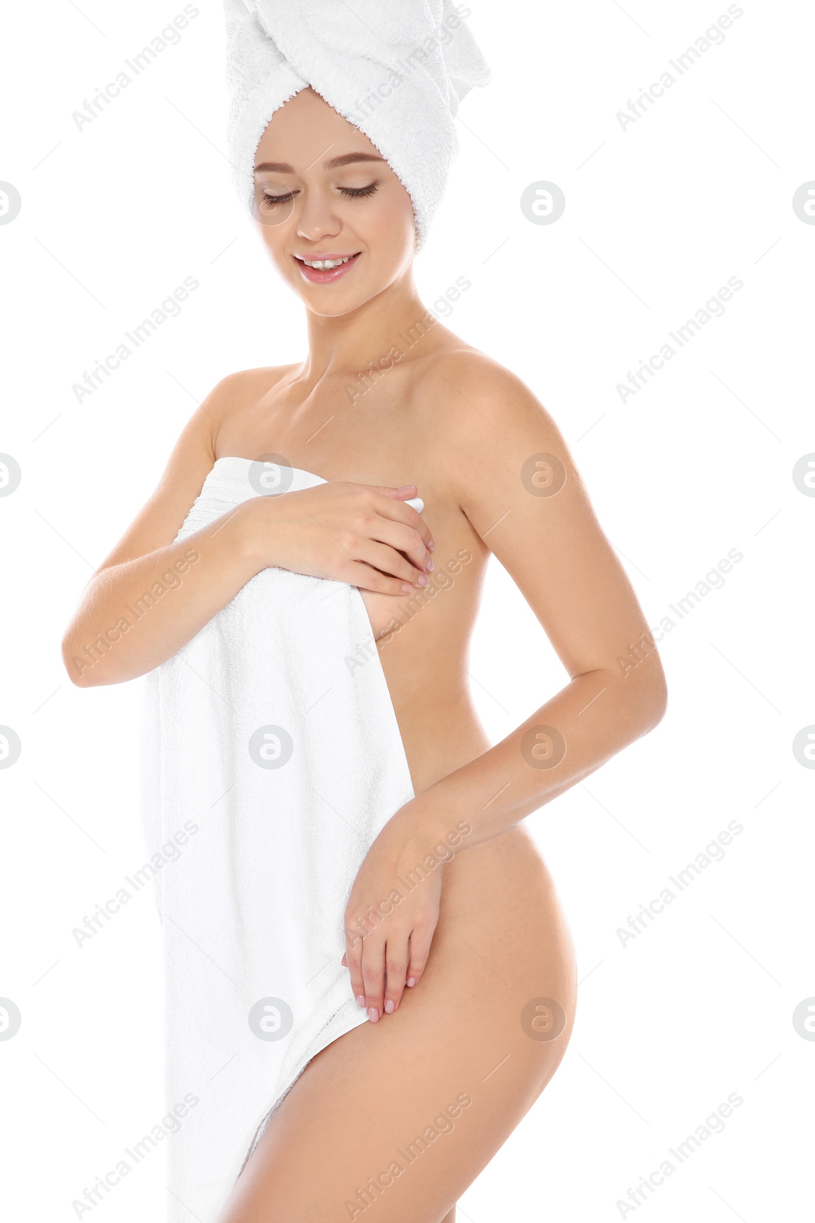 Photo of Portrait of young pretty woman with towels on white background