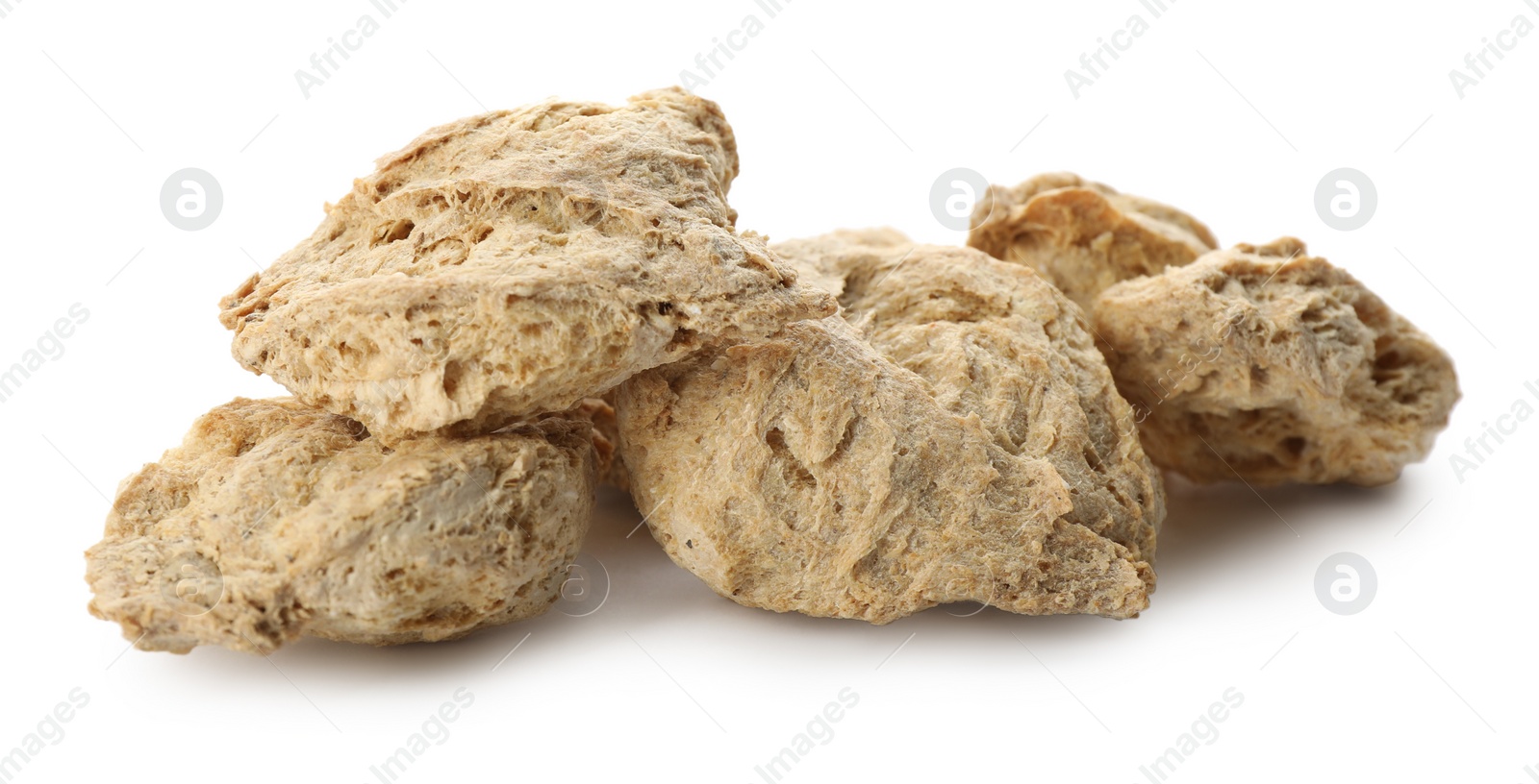 Photo of Dehydrated soy meat chunks on white background