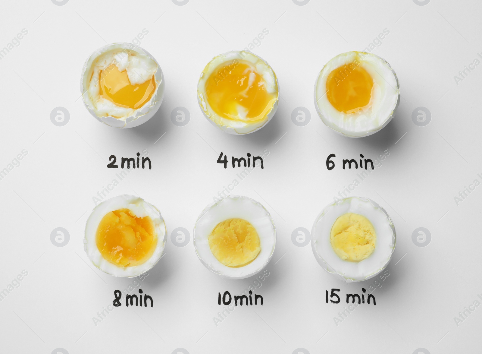 Photo of Different cooking time and readiness stages of boiled chicken eggs on white background, flat lay