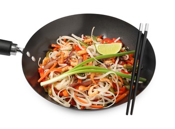 Shrimp stir fry with noodles and vegetables in wok isolated on white