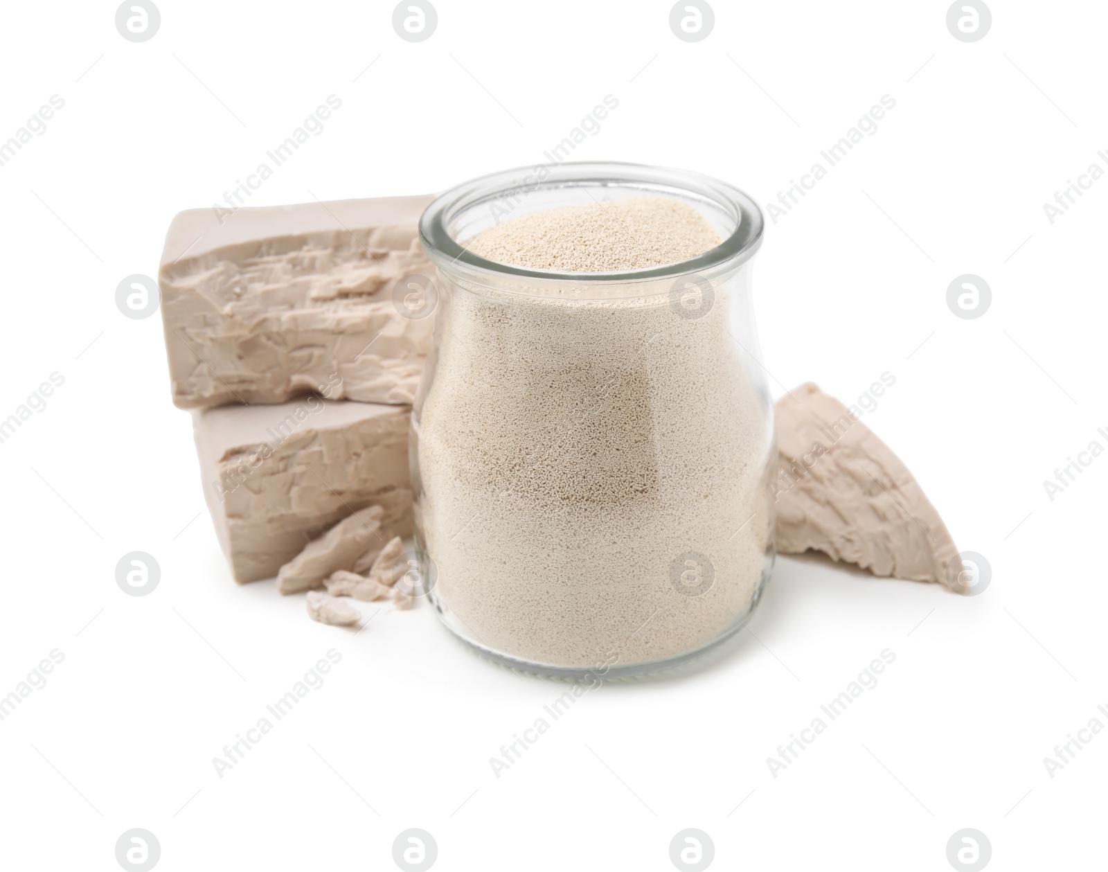 Photo of Compressed and granulated yeast on white background