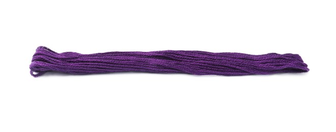 Photo of Bright purple embroidery thread on white background