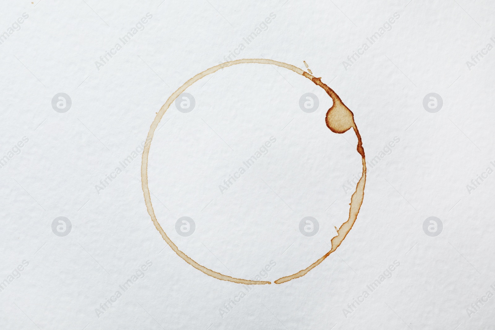 Photo of Dried coffee cup stain on white background, top view