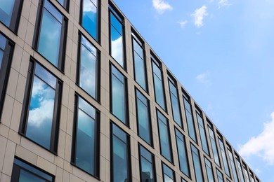 Modern building against blue sky, low angle view