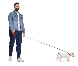 Smiling man walking with dog on white background