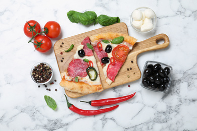 Flat lay composition with pieces of delicious pizza Diablo and ingredients on white marble background