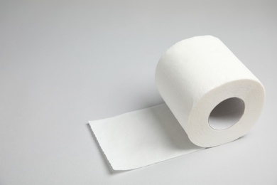 Toilet paper roll on grey background. Space for text