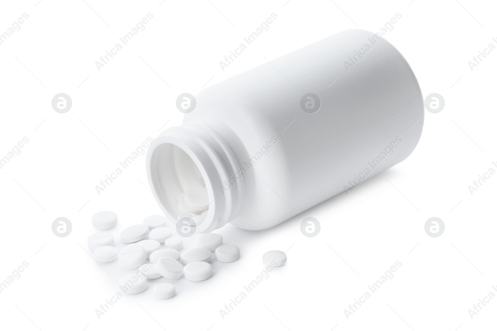 Photo of Scattered pills and open container isolated on white