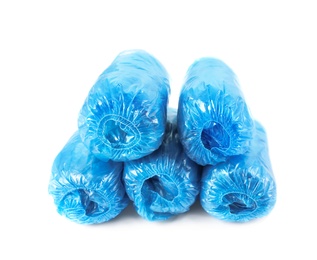 Photo of Medical blue shoe covers on white background